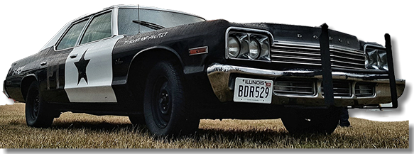 This is an image of a replica model of The Blues Brothers car - A.K.A. The Bluesmobile, owned by Dave Wiggins.